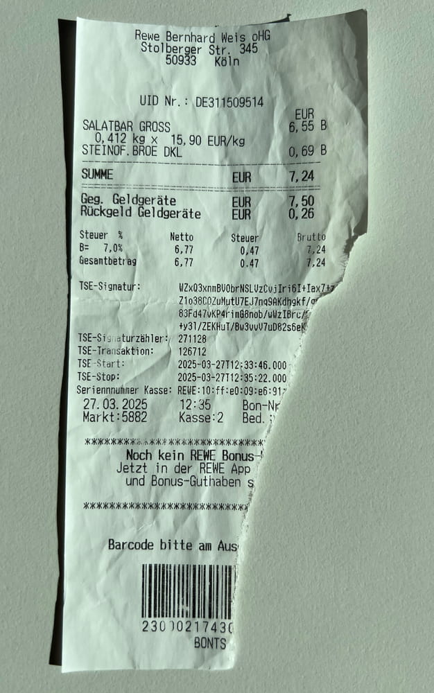 Beispiel eines schlecht fotografierten Bons
